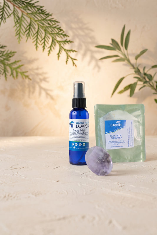 Loakin foundation ritual skincare set: blue dropper bottle, green pouch, gray stone